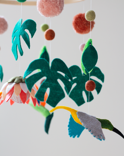 Close-up of handcrafted African wildlife animals and foliage on the Big Five Classic Hoop Mobile.