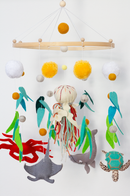 Handmade ocean-themed hanging mobile inspired by marine wildlife with manta ray, crab, turtle and whale