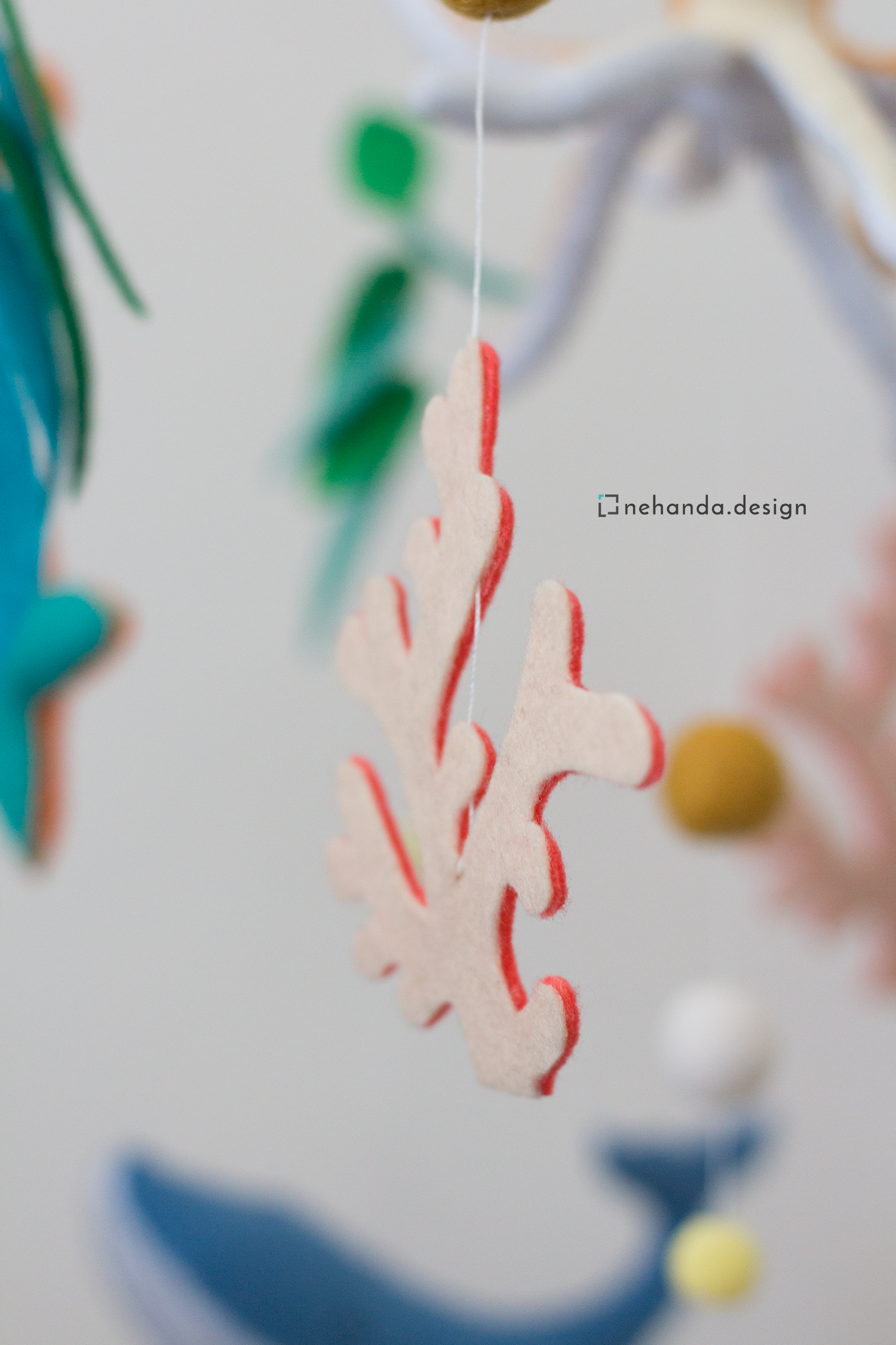 Decorative ocean mobile with whale, turtle, penguin and coral