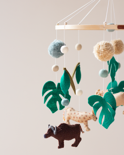 Close-up of handcrafted African wildlife animals and foliage on the Big Five Classic Hoop Mobile.