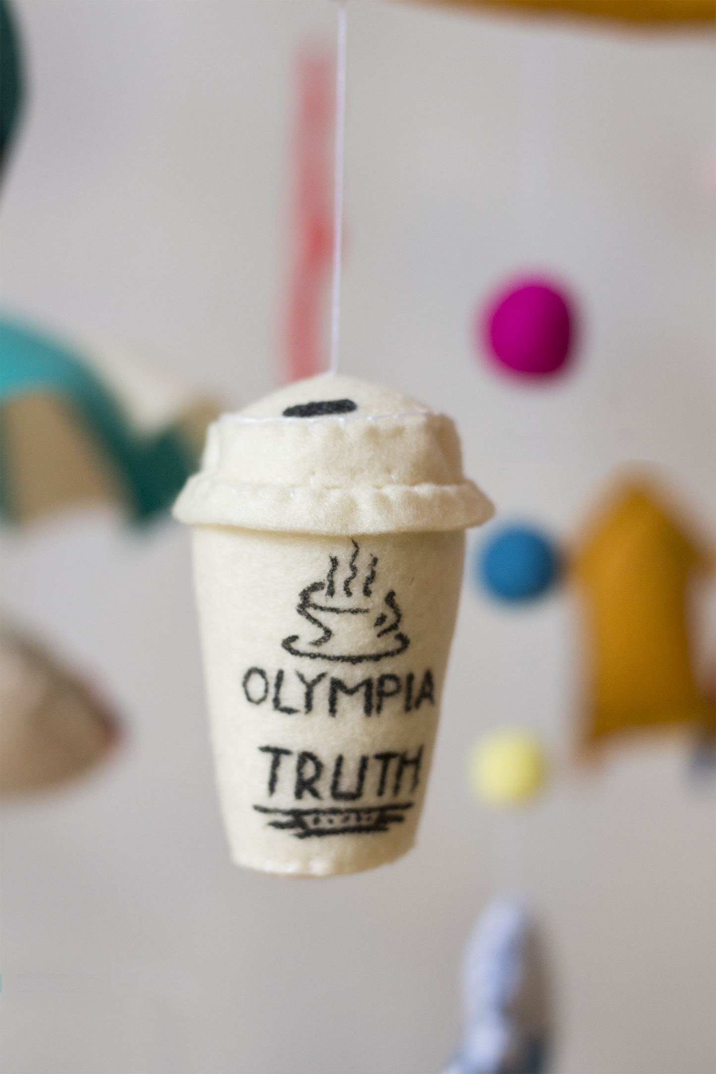 Close-up of the handcrafted takeaway coffee cup from olympia bakery on the Kalk Bay mobile
