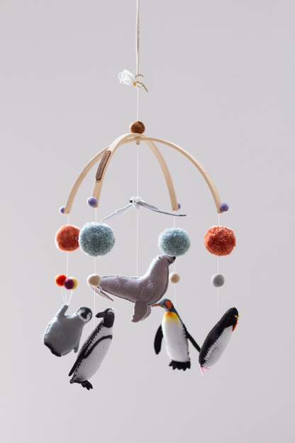 Decorative penguin hanging mobile inspired by coastal wildlife