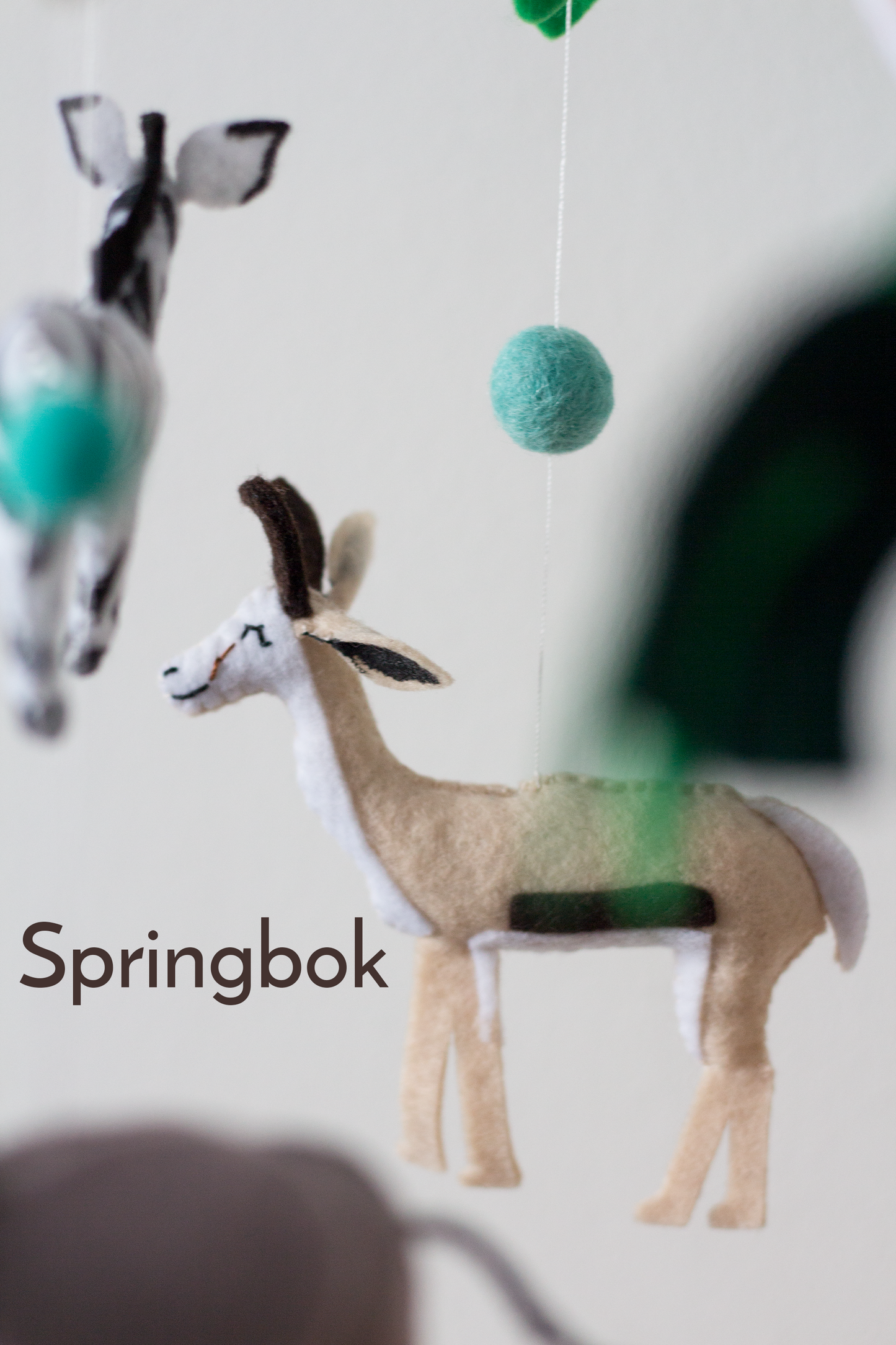 Decorative African wildlife mobile with handcrafted felt springbok