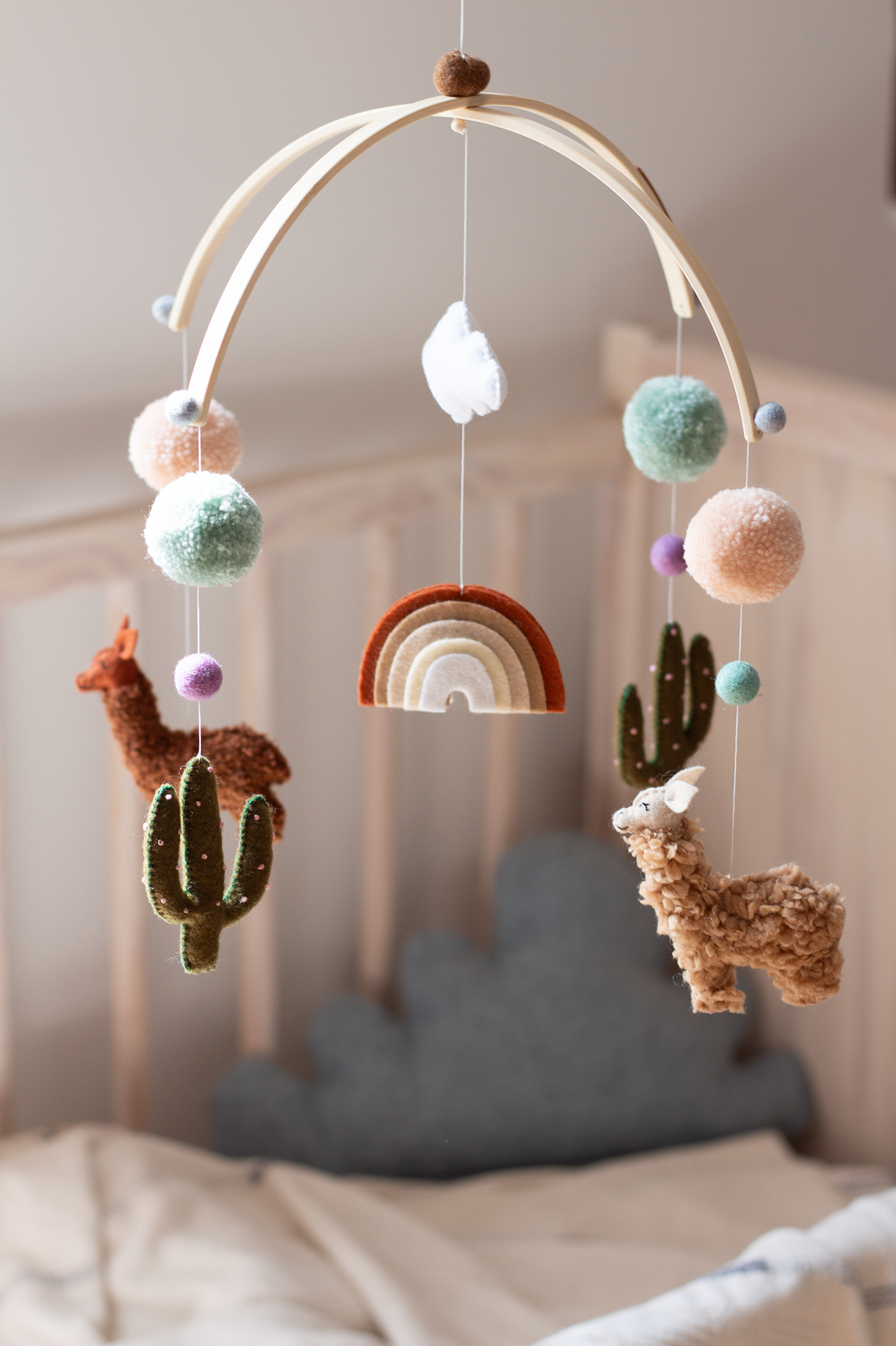 Handcrafted alpaca hanging mobile with rainbow and cacti