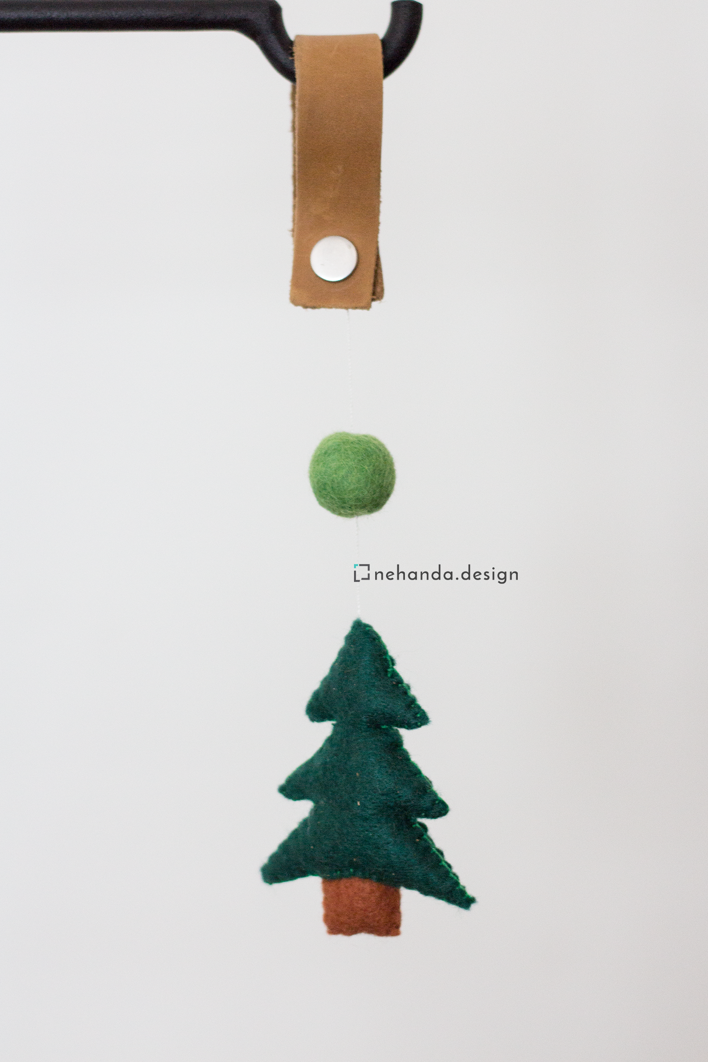 Decorative felt bag charms with reclaimed leather straps and pine tree